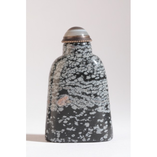 132 - A CHINESE 'SNOWFLAKE' OBSIDIAN SNUFF BOTTLE

probably 20th century, with numerous white natural incl... 