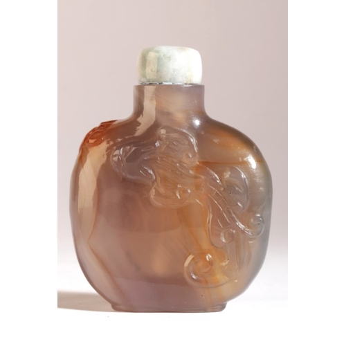 144 - A CHINESE AGATE SNUFF BOTTLE

19th century, the purple-grey body carved to both sides with a chilong... 