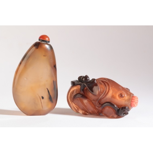 149 - A CHINESE AGATE SNUFF BOTTLE

likely 18th/19th century, of organic form with dispersed black inclusi... 