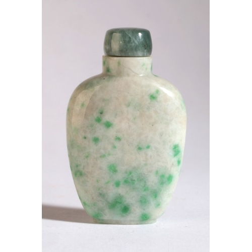 15 - A CHINESE JADEITE SNUFF BOTTLE

19th century, carved to one side with a figure in a boat beneath a p... 