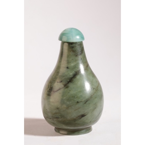 155 - A CHINESE JADE SNUFF BOTTLE

19th century, the pear shaped bottle with dark 'swirling' striations, 6... 