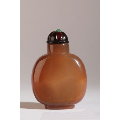 165 - A CHINESE AGATE SNUFF BOTTLE

likely 18th/19th century, the pale skin carved with an old man and a b... 