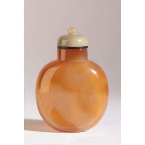 166 - A CHINESE AGATE SNUFF BOTTLE

probably 19th century, the red skin carved with two horses, one pranci... 