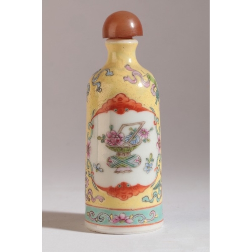 169 - A CHINESE PORCELAIN FAMILLE ROSE SNUFF BOTTLE

bearing a four character Qianlong mark to the base, d... 