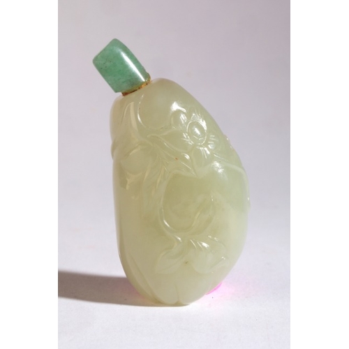 17 - A CHINESE JADEITE 'GOURD' SNUFF BOTTLE

19th century, carved in low relief with flowers and foliage,... 