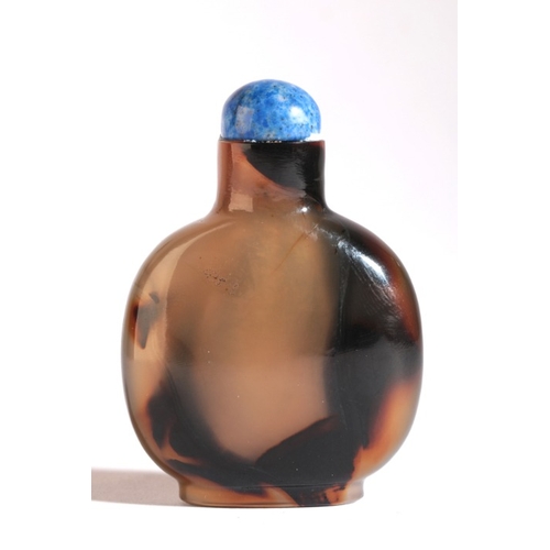 176 - A CHINESE AGATE SNUFF BOTTLE

19th century, with dark natural inclusions to the body, 5.5cm high ove... 