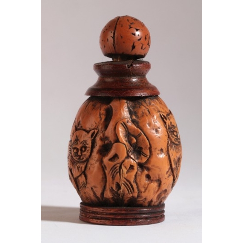 179 - A CHINESE WALNUT SNUFF BOTTLE

1850-1899, the shell carved with the design of two cats separated by ... 