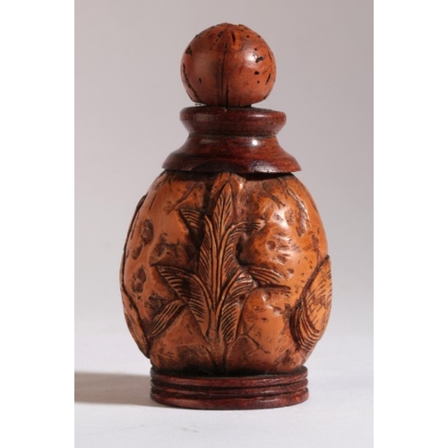 179 - A CHINESE WALNUT SNUFF BOTTLE

1850-1899, the shell carved with the design of two cats separated by ... 