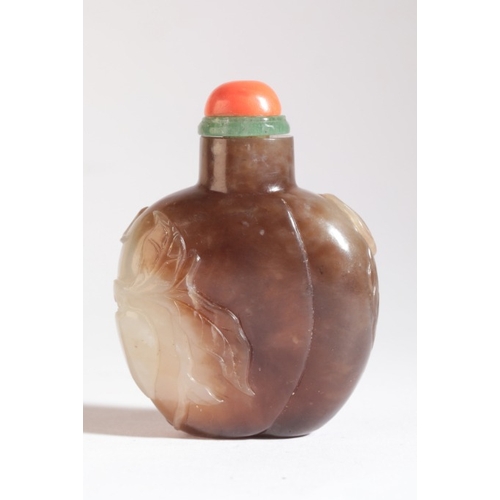 183 - A CHINESE JADE SNUFF BOTTLE

19th century, the bulbous body carved with leaves and hanging fruit, 6c... 