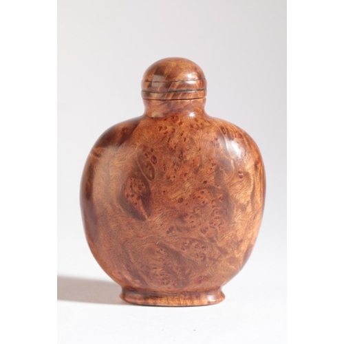 186 - A CHINESE BURR WOOD SNUFF BOTTLE

19th century, of bulbous form, with conforming stopper, 6.5cm high... 