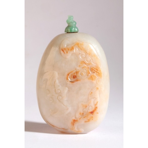 27 - A CHINESE JADE SNUFF BOTTLE

late 18th/19th century, of pebble form, carved with bats flying amongst... 