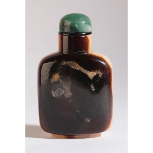 30 - A CHINESE AGATE SNUFF BOTTLE

19th century, carved to one side with a phoenix standing amongst flowe... 