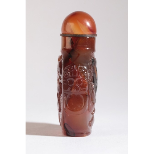 31 - A CHINESE AGATE SNUFF BOTTLE

19th century, of square form with a carved coiled dragon to one side a... 