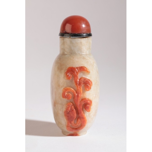 38 - A CHINESE JADE SNUFF BOTTLE

18th/19th century, of pale green colour with russet carved lingzhi deco... 