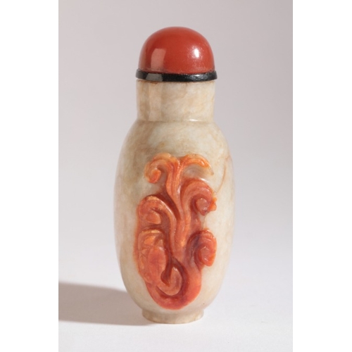 38 - A CHINESE JADE SNUFF BOTTLE

18th/19th century, of pale green colour with russet carved lingzhi deco... 