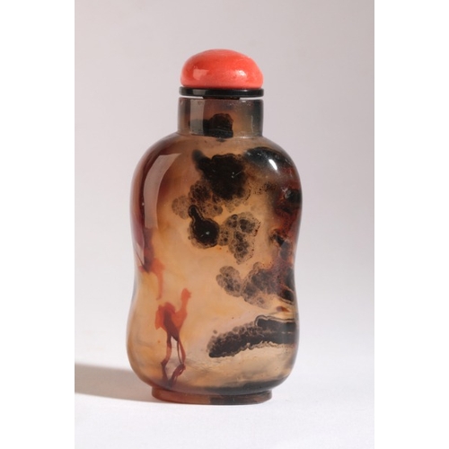 39 - A CHINESE AGATE SNUFF BOTTLE

18th/19th century, with several red and brown/black inclusions, some i... 