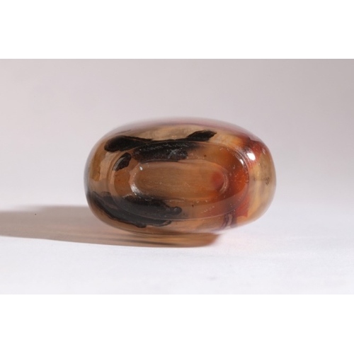 39 - A CHINESE AGATE SNUFF BOTTLE

18th/19th century, with several red and brown/black inclusions, some i... 