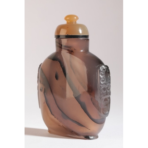 43 - A CHINESE AGATE SNUFF BOTTLE

18th/19th century, with carved mask and ring handles to each side, 8cm... 