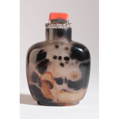 45 - A CHINESE AGATE SNUFF BOTTLE

18th/19th century, of square form with black inclusions, topped with a... 