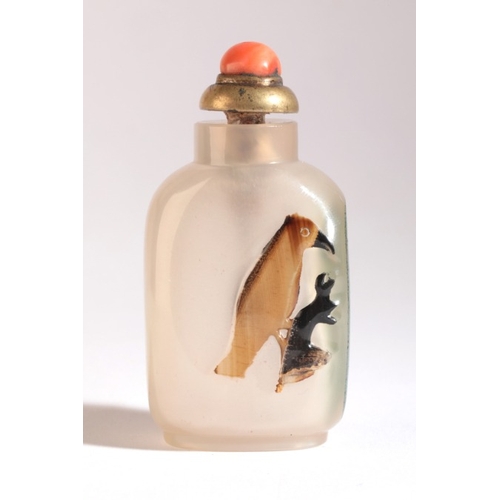 50 - A CHINESE AGATE SNUFF BOTTLE

19th century, the brown and black inclusions to the front carved into ... 