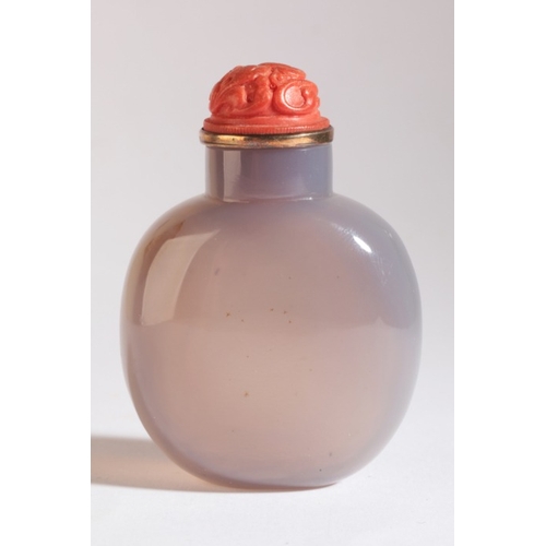 52 - A CHINESE AGATE SNUFF BOTTLE

19th century, a tethered horse carved in relief to the front, the cora... 