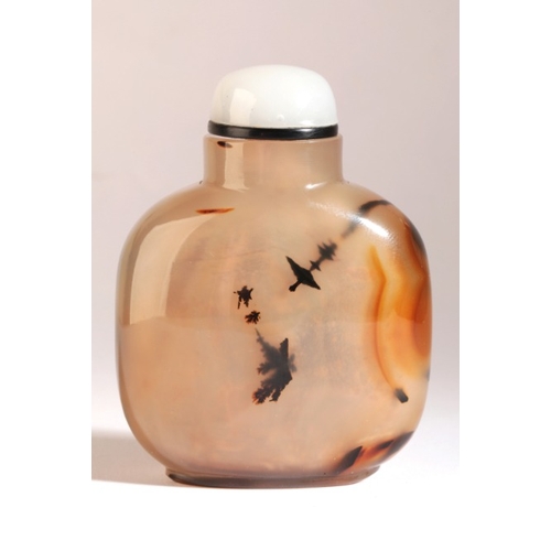 58 - A CHINESE AGATE SNUFF BOTTLE

18th/19th century, the pale brown body with black inclusions to the fr... 