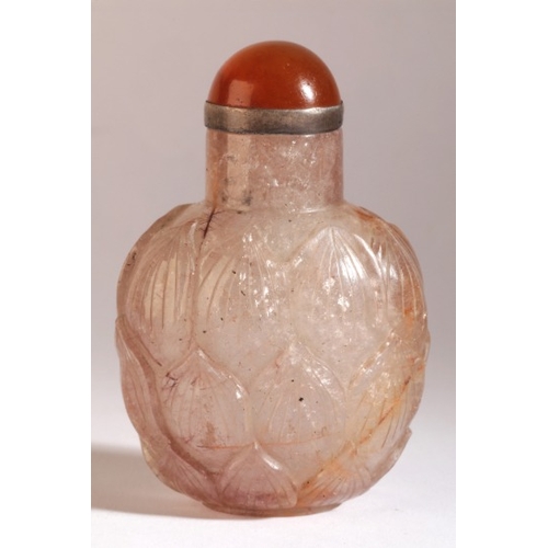 63 - A CHINESE CRYSTAL SNUFF BOTTLE

18th/19th century, of square form with rounded shoulders, carved in ... 