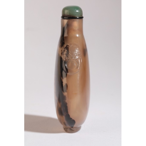 69 - A CHINESE AGATE SNUFF BOTTLE

18th/19th century, with natural dark inclusions to one side giving the... 