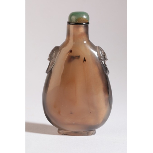 69 - A CHINESE AGATE SNUFF BOTTLE

18th/19th century, with natural dark inclusions to one side giving the... 