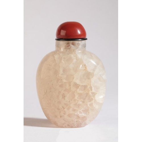 74 - A CHINESE QUARTZ SNUFF BOTTLE

19th century, the pale body with a contrasting russet skin carved as ... 