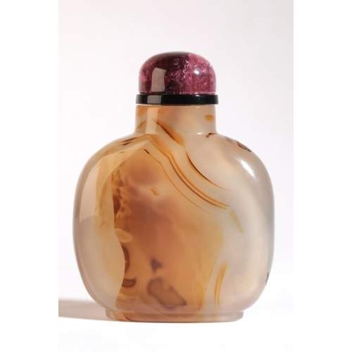 77 - A CHINESE AGATE SNUFF BOTTLE

19th century, of rectangular form, carvings on dark inclusions depict ... 