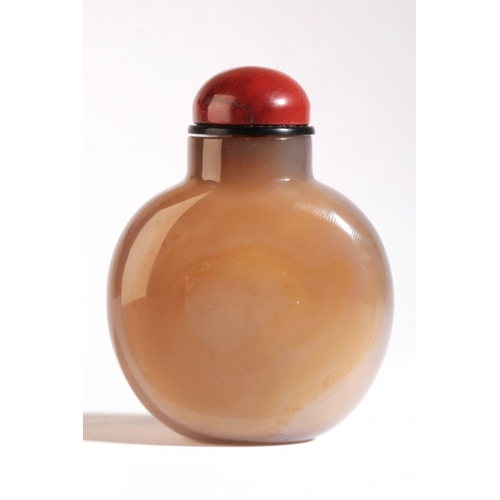 78 - A CHINESE 'SILHOUETTE' AGATE SNUFF BOTTLE

19th century, the orange/brown skin to the front carved w... 