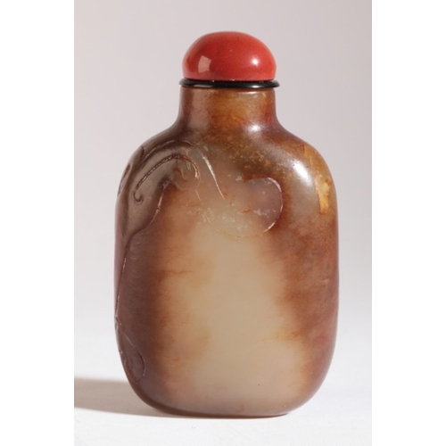 86 - A CHINESE JADE SNUFF BOTTLE

probably early 18th century, the yellow-green nephrite body carved with... 