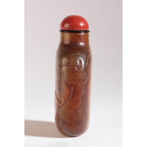 86 - A CHINESE JADE SNUFF BOTTLE

probably early 18th century, the yellow-green nephrite body carved with... 