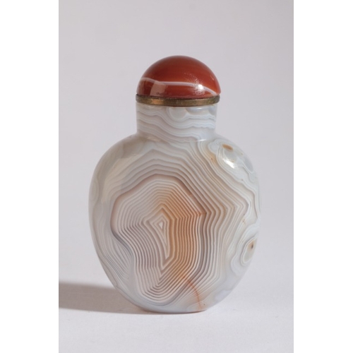 89 - A CHINESE AGATE SNUFF BOTTLE

19th century, each side with 'thumbprint' concentric striations, 6cm h... 