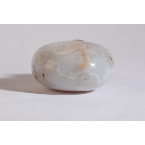 89 - A CHINESE AGATE SNUFF BOTTLE

19th century, each side with 'thumbprint' concentric striations, 6cm h... 