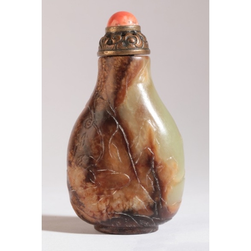 92 - A CHINESE JADE SNUFF BOTTLE

18th century, the yellow-green nephrite carved with goats in a rocky la... 