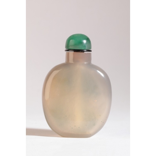 94 - A CHINESE AGATE SNUFF BOTTLE

19th century, the green silhouette inclusion carved with a monkey swin... 