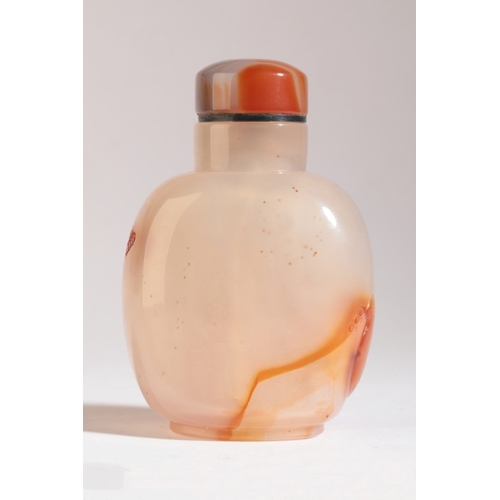 97 - A CHINESE AGATE SNUFF BOTTLE

probably 19th century, carved to the front with a squirrel in a tree a... 