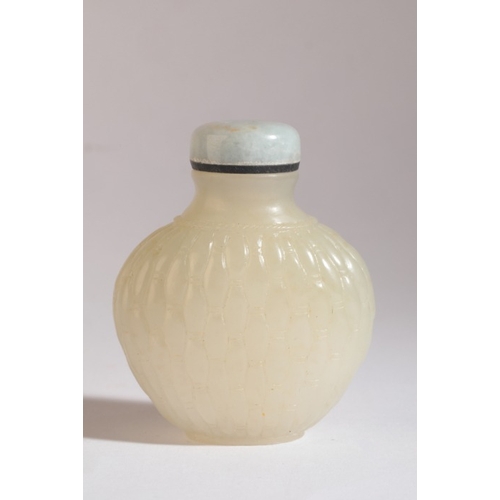 98 - A CHINESE JADE SNUFF BOTTLE

18th/19th century, the white nephrite body carved all over with a baske... 