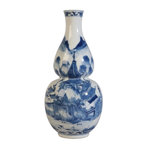 200 - A CHINESE PORCELAIN BLUE AND WHITE DOUBLE GOURD VASE

bearing a four character Kangxi mark to the ba... 