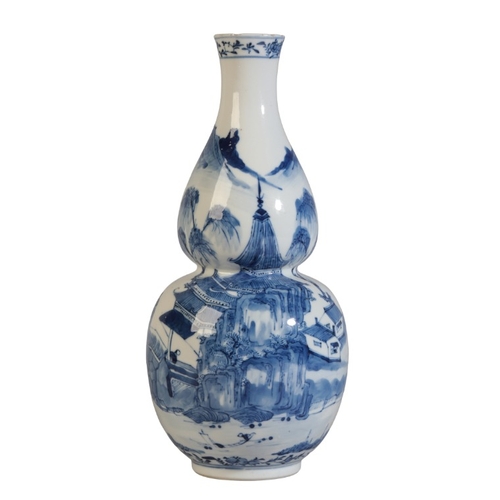 200 - A CHINESE PORCELAIN BLUE AND WHITE DOUBLE GOURD VASE

bearing a four character Kangxi mark to the ba... 