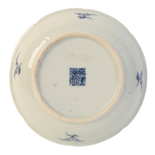 214 - A CHINESE PORCELAIN BLUE AND WHITE DISH

bearing a four character Jiaqing seal mark, Qing dynasty, w... 