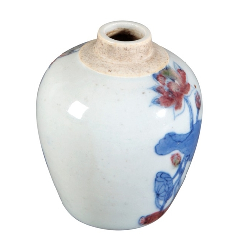 262 - A CHINESE PORCELAIN BLUE, WHITE AND RED JAR

probably 19th century, decorated with blossoming flower... 