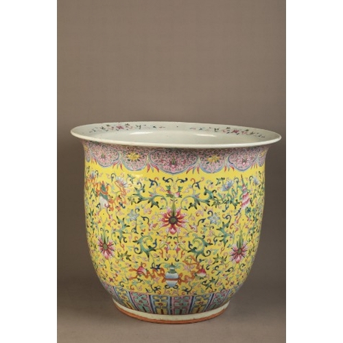 292 - A LARGE CHINESE FAMILLE ROSE JARDINIERE

late Qing dynasty, the yellow ground decorated with lotus f... 