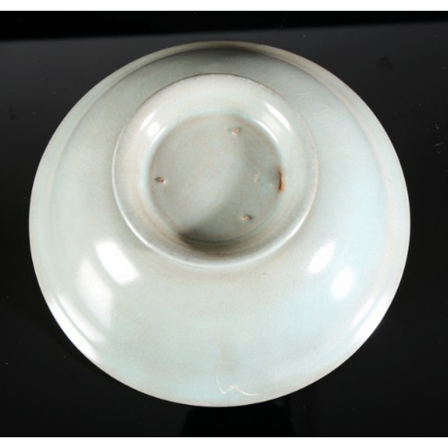 316 - A CHINESE PORCELAIN CELADON GLAZED BOWL

20th century, with flared rim and turned foot, 5.5cm high x... 