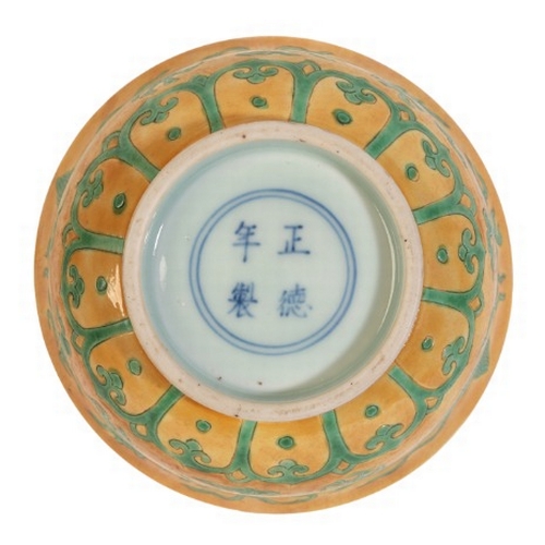 318 - A CHINESE PORCELAIN YELLOW GROUND 'DRAGON' BOWL

bearing a four character Zhengde mark to the base, ... 