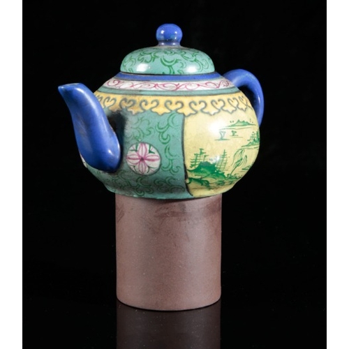 333 - A CHINESE YIXING TEAPOT

late 19th century/early 20th century, painted in polychrome with mountainou... 