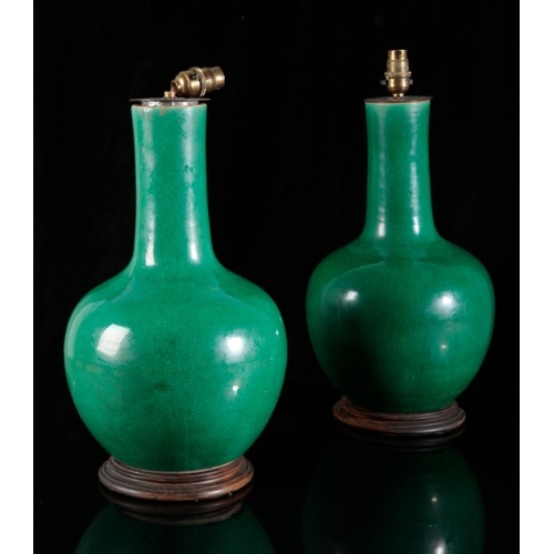 344 - A PAIR OF CHINESE PORCELAIN GREEN CRACKLE GLAZED BOTTLE VASES

19th/20th century, later converted to... 