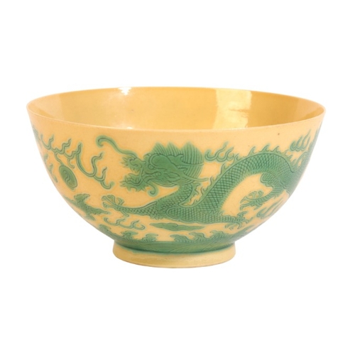 351 - A CHINESE PORCELAIN YELLOW GROUND 'DRAGON' BOWL

bearing a six character Xuantong mark to the base, ... 